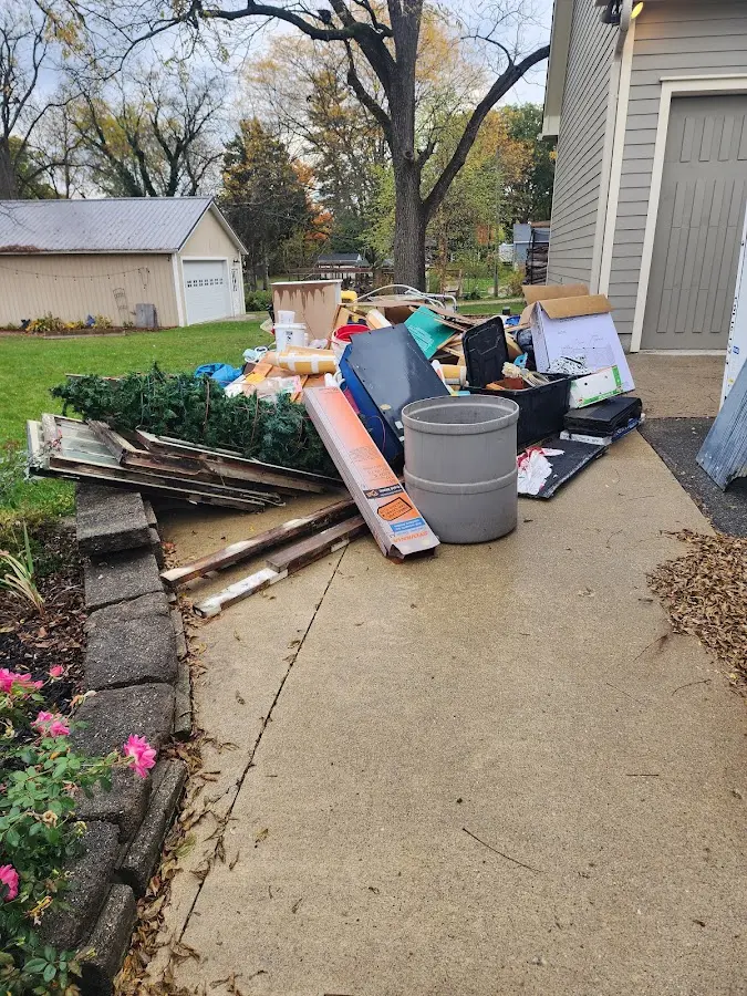 Dumpster being loaded with debris for Commercial Dumpster Rental in Branchburg